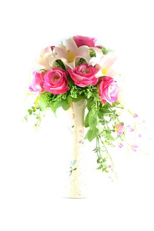 Multicolored flowers in a vase, isolated on white background の写真素材