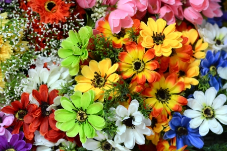 beautiful colors of plastic flowers の写真素材