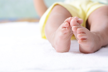 Close up of newborn baby feet の写真素材