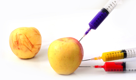 Apple and syringes isolatedの写真素材
