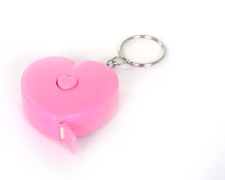 Measuring tape in heart rollの写真素材