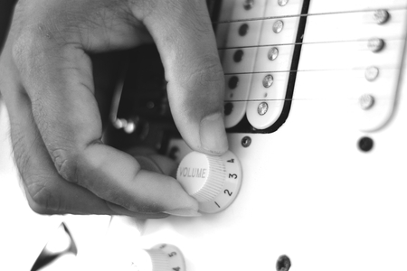 hand on volume control の写真素材
