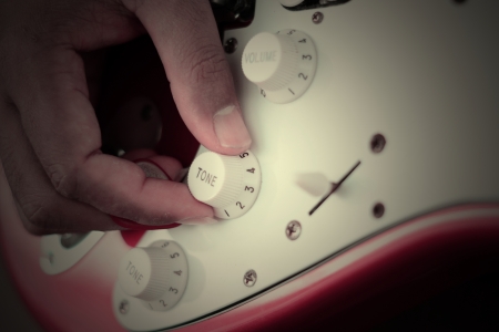 hand on tone control 