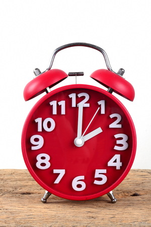 red alarm clock, showing timeの写真素材