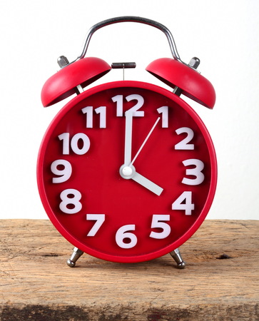 red alarm clock, showing timeの写真素材