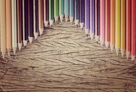 Colour pencils on wood backgroundの写真素材