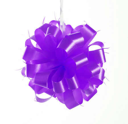 purple bow ribbon isolated on whiteの写真素材