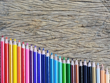 Colour pencils on wood backgroundの写真素材