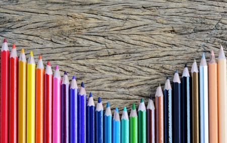 Colour pencils on wood backgroundの写真素材