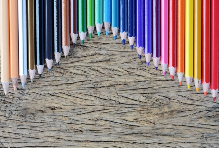 Colour pencils on wood backgroundの写真素材