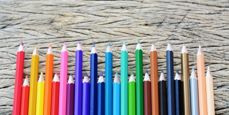 Colour pencils on wood backgroundの写真素材