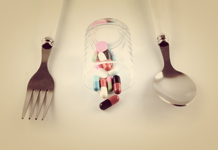 Spoon Fork with pillsの写真素材