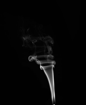 White smoke on black background の写真素材