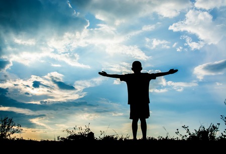 Little boy jumping to sky , Sillhouette conceptの写真素材