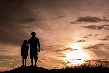 Father and son looking for future,  silhouette conceptの写真素材