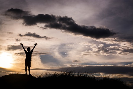 kid silhouette,Moments of the child's joy. On the Nature sunsetの写真素材