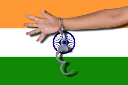 handcuffs with hand on India flagの写真素材