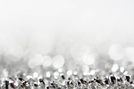 abstract silver white bokeh lights backgroundの写真素材