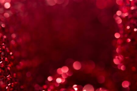 Red bokeh holiday textured Christmas decorations background