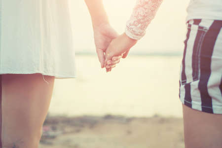 Happy Friends holding hands in nature, encouraging concept.の写真素材