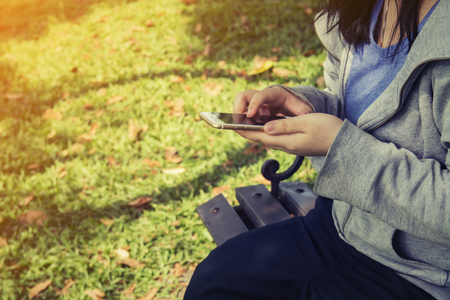 Women send message from phone to someoneの写真素材