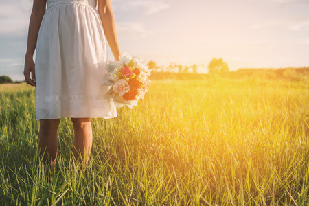 close-up. young woman with bouquet in hands.の写真素材