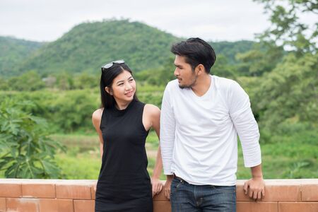Portrait of an attractive woman seriously listening to her boyfriend while on a date,spend good time together.の写真素材
