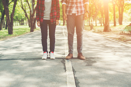 Young teenagers couple walking together in park, Relaxing holiday.の写真素材