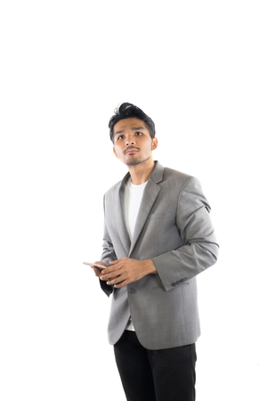 Businessman hipster holding  phone on isolated white background.の写真素材
