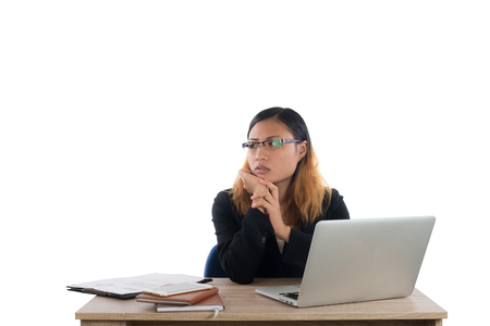 Business woman working on computer isolated on white background.の写真素材
