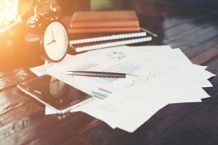business documents with charts growth, phone and pen. workplace businessman.の写真素材