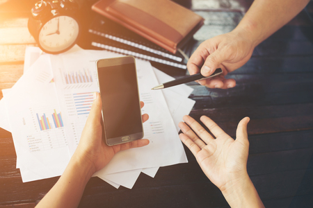 Close-up shot of an analytical team working with the latest financial results, Office life concept.の写真素材
