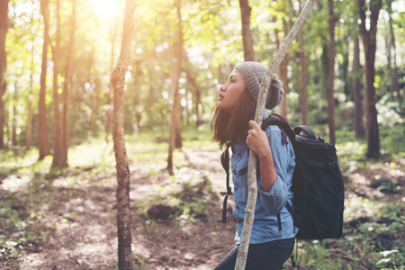 Hipster young woman hiking holiday, wild adventure.の写真素材