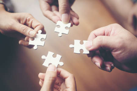 Hand holding jigsaw puzzles, Business partnership concept.の写真素材