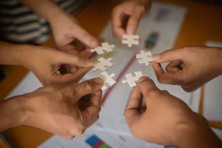 Hand holding jigsaw puzzles, Business partnership concept.の写真素材