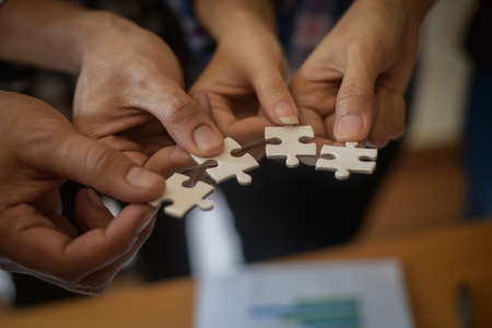 Hand holding jigsaw puzzles, Business partnership concept.の写真素材