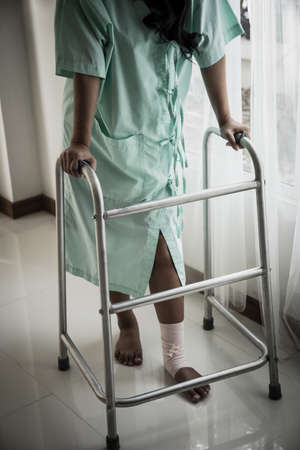 Woman using a walking aids in the hospital room
