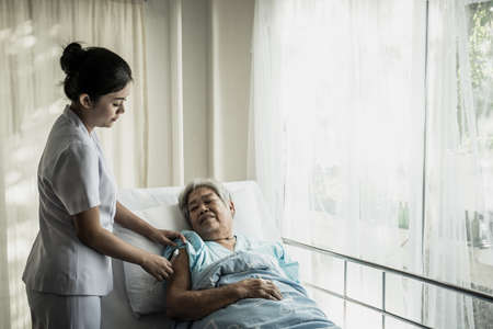 Nurse injections for elderly patients admitted to hospital.の写真素材