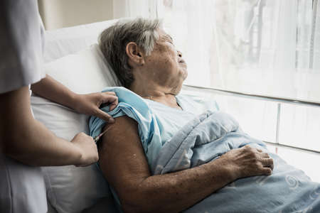 Nurse injections for elderly patients admitted to hospital.の写真素材