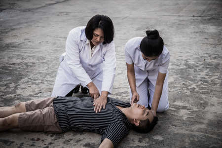 Emergency CPR on a Man, Nurse try to Process Resuscitation (First Aid)の写真素材