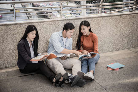 Group students studying researching on laptop sitting Together .の写真素材