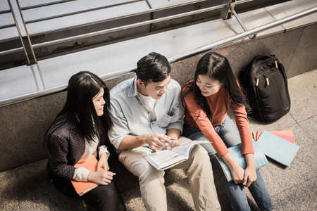 Group students studying researching on laptop sitting Together .の写真素材