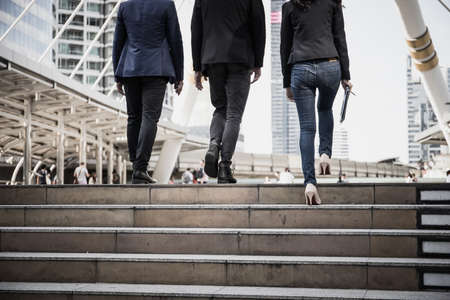 Group of Business people Walking up the stairs the way to go work.の写真素材