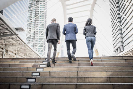 Group of Business people Walking up the stairs the way to go work.の写真素材