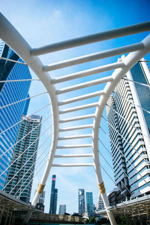 Skyscraper against blue sky eyes view looking up into the sky.の写真素材
