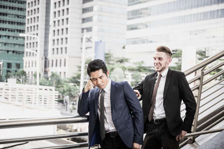 Young business man to think and not Work with stress Pretending feeling so disappointed.の写真素材