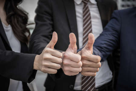 Business teamwork thumbs up together for agreement and success business.の写真素材