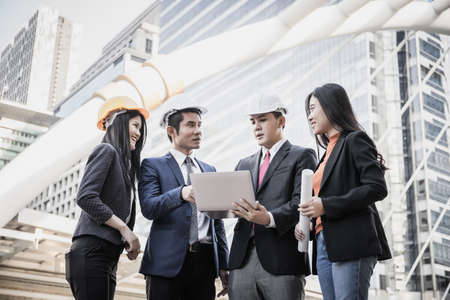 Team of architecture and engineering meeting and talk about  building construction projectの写真素材