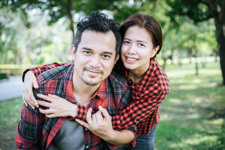 Happy to be together. beautiful young loving couple standing outdoorsの写真素材