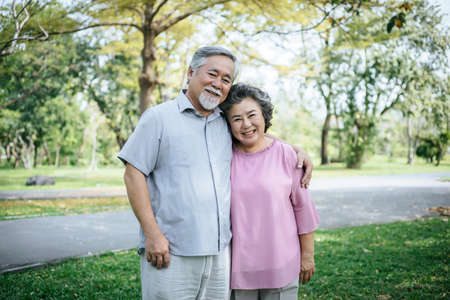 Happy senior couple in the parkの写真素材